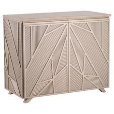 a white cabinet with an abstract design on it