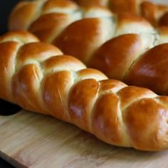 a close up of a loaf of bread on a cutting board