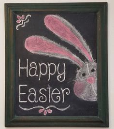 a chalkboard with the words happy easter written on it and a bunny in front