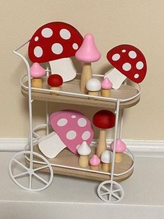 there is a toy cart with mushrooms on it