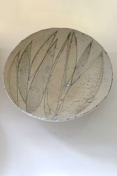 a white bowl sitting on top of a table