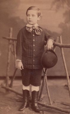 an old black and white photo of a young boy