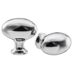 two shiny chrome door knobs on a white background