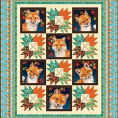 a quilt with pictures of foxes on it