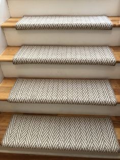 a set of stairs with carpeted treads