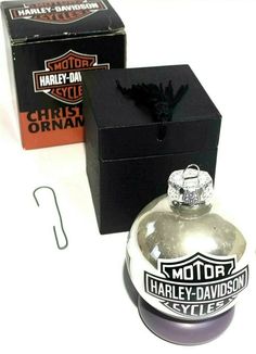 an empty harley davidson ornament next to a box