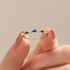 The Basic Infinity Sapphire Stacking Ring is available in various sizes, ensuring a perfect fit for every individual. Its adjustable feature allows you to customize the fit according to your preference, ensuring ultimate comfort and convenience. Whether you're purchasing it for yourself or as a thoughtful gift for a loved one, this ring is guaranteed to deliver an exquisite and personalized experience. Ring Details ❥ Gold KT: 14k 18k 10k Solid Gold ❥ Gold Color Options; Yellow Gold, White Gold, Gold And Blue Ring, Blue Sapphire Gold Ring, Dainty Sapphire Ring, Marquise Sapphire Ring, Infiniti Ring, Wedding Rings Blue, Sapphire Ring Gold, Marquise Band, Wedding Ring Minimalist