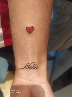 a person's arm with a small tattoo that says melba on the wrist