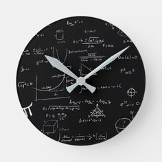 a black and white clock with many calculations on the back side, it's time to learn math