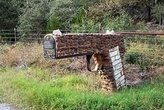 there is a mailbox made out of rocks