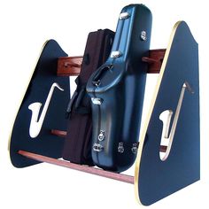 two pieces of luggage sitting on top of a wooden shelf with hooks and handles attached to it