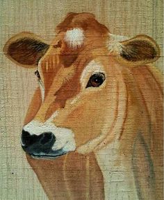 a painting of a brown cow with white spots on it's face and nose