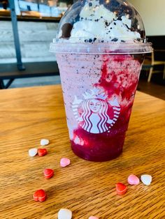 a starbucks drink with sprinkles on the table