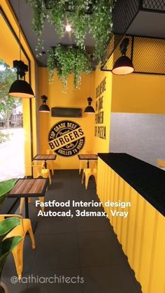 an outdoor restaurant with yellow walls and black tables