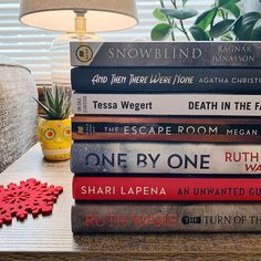 a stack of books sitting on top of a table