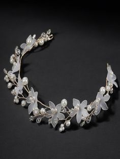 Adorn your hair with this exquisite bridal headband. Featuring delicate floral accents, shimmering crystals, and beaded pearls, this headpiece adds a touch of ethereal beauty to your wedding day look. Material: - Copper Wire Size: - 20x4x1cm Key Features: - Elegant Design - Flexible & Comfortable - High-Quality Materials Floral Headpiece Wedding, Boho Bridal Hair, Pearl Bridal Headband, Crystal Hair Vine, Bridal Hair Accessory, Pearl Bridal, Boho Bridal, Hair Vine, Floral Headbands