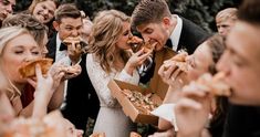 a group of people are eating pizza together