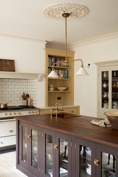 a kitchen with an island and cabinets in it