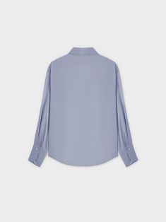 This Oversized Satin Blouse-Ocean Blue is perfect for adding a touch of elegance to any outfit. With its flowy, oversized fit and satin-like fabric, it offers both comfort and style. Elegant Oversized Blouse With Shirttail Hem, Classic Blue Silk Blouse, Satin Button-up Tops For Daywear, Blue Long Sleeve Satin Top, Blue Satin Long Sleeve Top, Blue Long Sleeve Silk Top, Blue Silk Formal Tops, Silk Button-up Blouse, Chic Oversized Blue Blouse