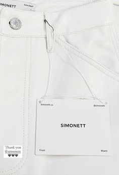 a label on the back of a pair of white pants that say, simonettot