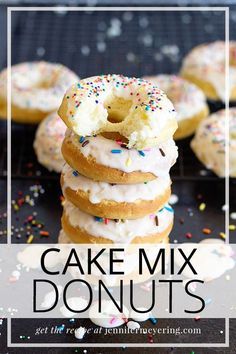 a stack of cake mix donuts with white frosting and sprinkles