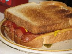 a grilled cheese sandwich with ketchup and mustard