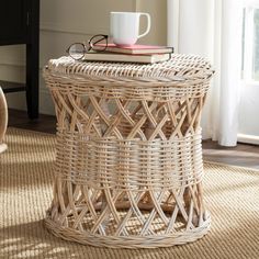 a wicker table with a coffee cup on top