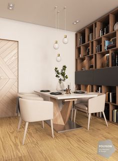 a dining room table with two chairs and a vase on the table in front of bookshelves