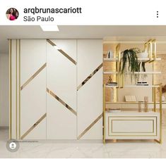 an image of a living room setting with white and gold accents on the doors, shelves and drawers