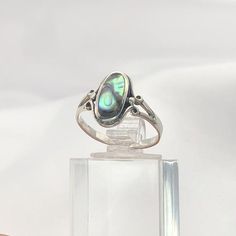 Sterling Silver Abalone Oval RingMaterial: Sterling silver with abalone shell ovalSize guide included as a photograph Free UK first class PostageComes with organza jewellery bagPlease note due to the use of natural materials such as abalone, turquoise and Opal; all rings are unique and may appear different to the photograph. Abalone Engagement Ring, Silver Gemstone Rings, Abalone Jewelry, Vintage Silver Rings, Shell Ring, Oval Rings, Abalone Shell, Funky Jewelry, Multi Stone Ring