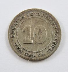 an old ten cents coin with the number ten on it