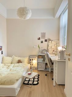 a bedroom with a bed and desk in it