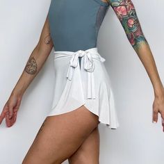 "Demi Wrap Skirts are made with an opaque, lightweight, poly/spandex blend fabric that is lightweight, 4-way stretch, and drapes beautifully on the body. Slightly longer in the back, these fun and versatile ballet mini skirts can be doubled as a swimsuit cover. Wrap style with a 1.75\" fabric waistband that ties on your left and has a sweetheart cut at the right side seam." Elegant Mini Skirt With Built-in Shorts, Chic Summer Tennis Skirt With Built-in Shorts, Elegant Fitted Mini Skirt With Built-in Shorts, Elegant Fitted Wrap Skirt, Chic Stretch Lined Mini Skirt, Stretch Skirt With Built-in Shorts, Chic Mini Skirt With Built-in Shorts And Flowy Fit, Chic Solid Skort With Built-in Shorts, Chic Skort With Built-in Shorts