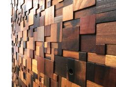 a wall made out of wooden planks with holes in the middle and small squares on each side