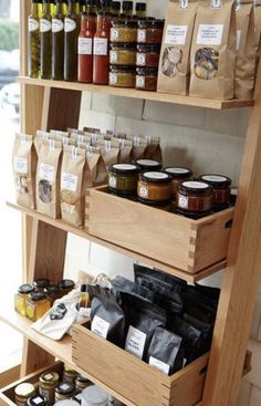 the shelves are filled with spices and condiments