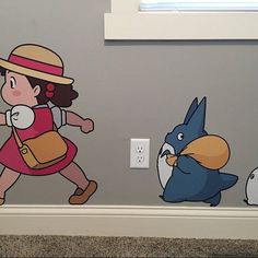 a child's room with cartoon characters painted on the wall, including a blue bird and a girl