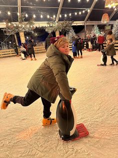 a woman riding on top of a snow covered ground