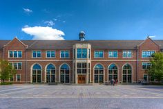 a large brick building with lots of windows