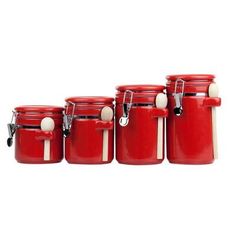 four red jars with white handles are lined up