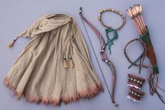 an assortment of jewelry and accessories laid out on a table