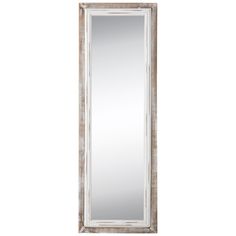 a large white mirror sitting on top of a wall