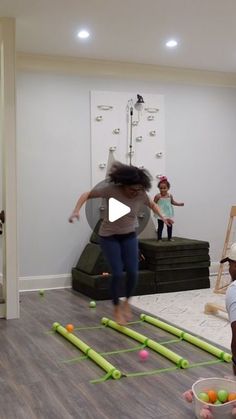 a group of children playing with toys in a living room