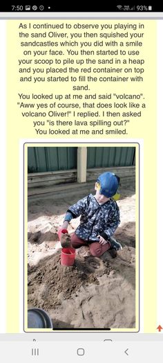 a child playing in the sand with a toy