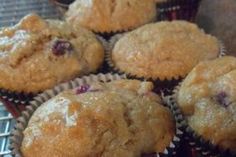 a bunch of muffins sitting on top of a cooling rack