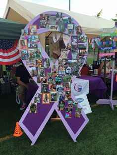 a purple ribbon with pictures on it and an american flag in the background at a fair