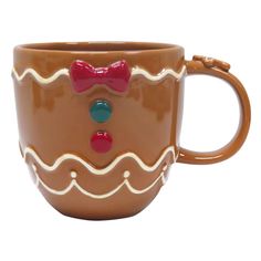 a coffee cup with a bow on the handle and handles, decorated like a gingerbread man