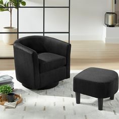 a black chair and ottoman in a room