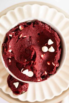 a bowl filled with red velvet and white hearts