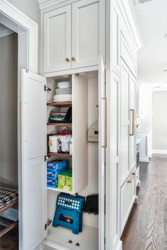 an open cabinet in the middle of a room