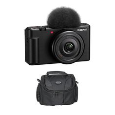 a camera with a microphone attached to it and a bag next to it on a white background